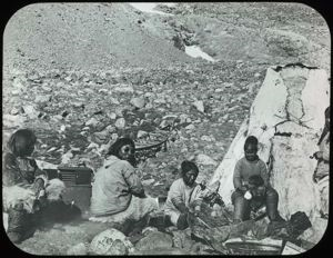 Image: Four Eskimos [Inuit] Sitting Near Tupik